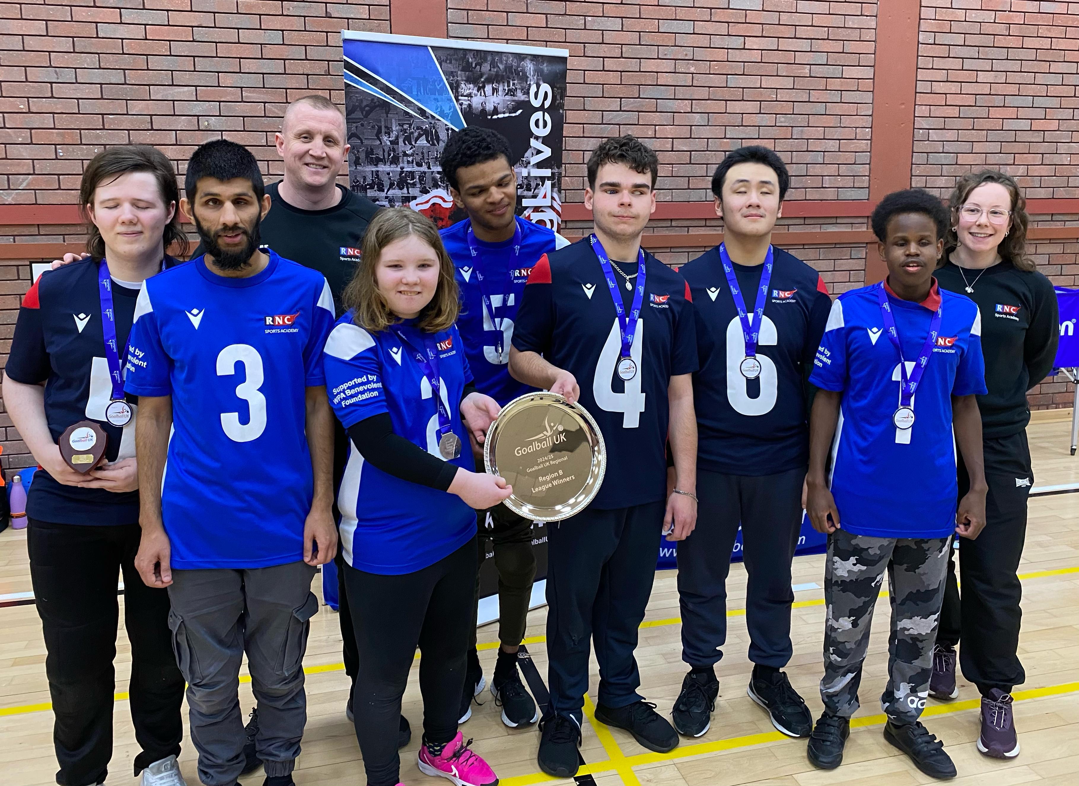 Both teams and coaches with their medals and trophies