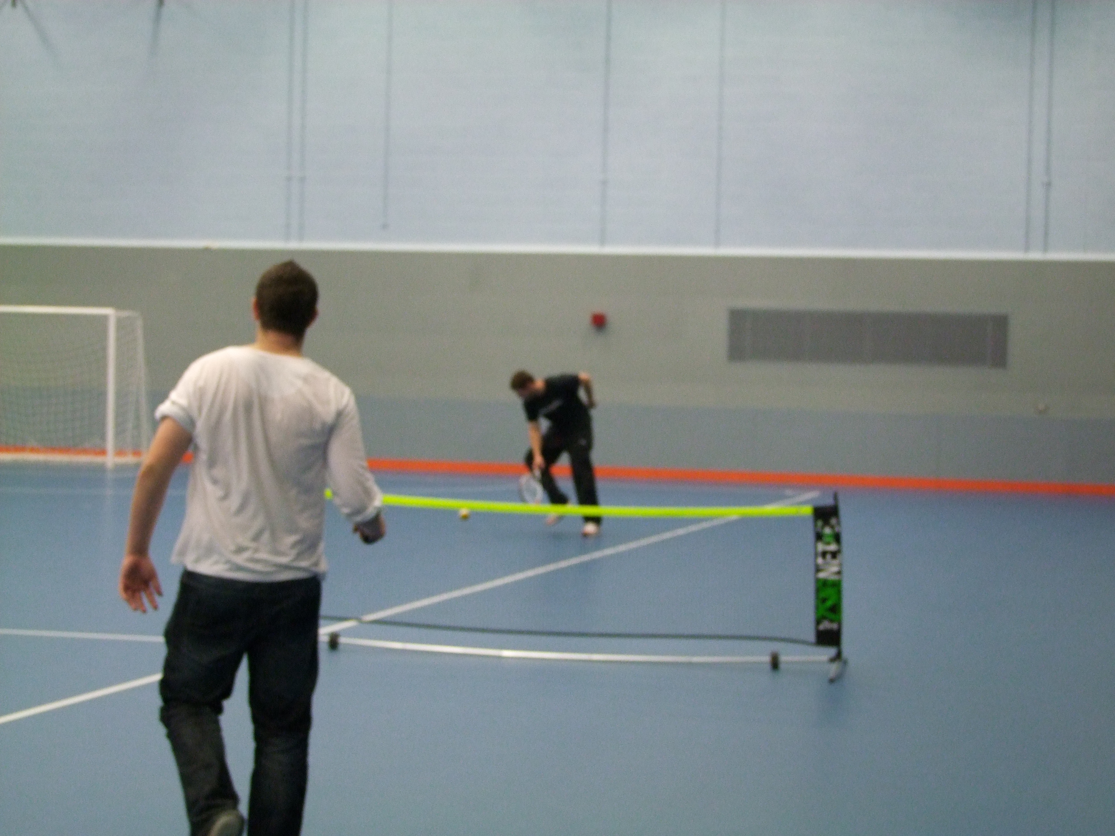 two male tennis players enjoying a game