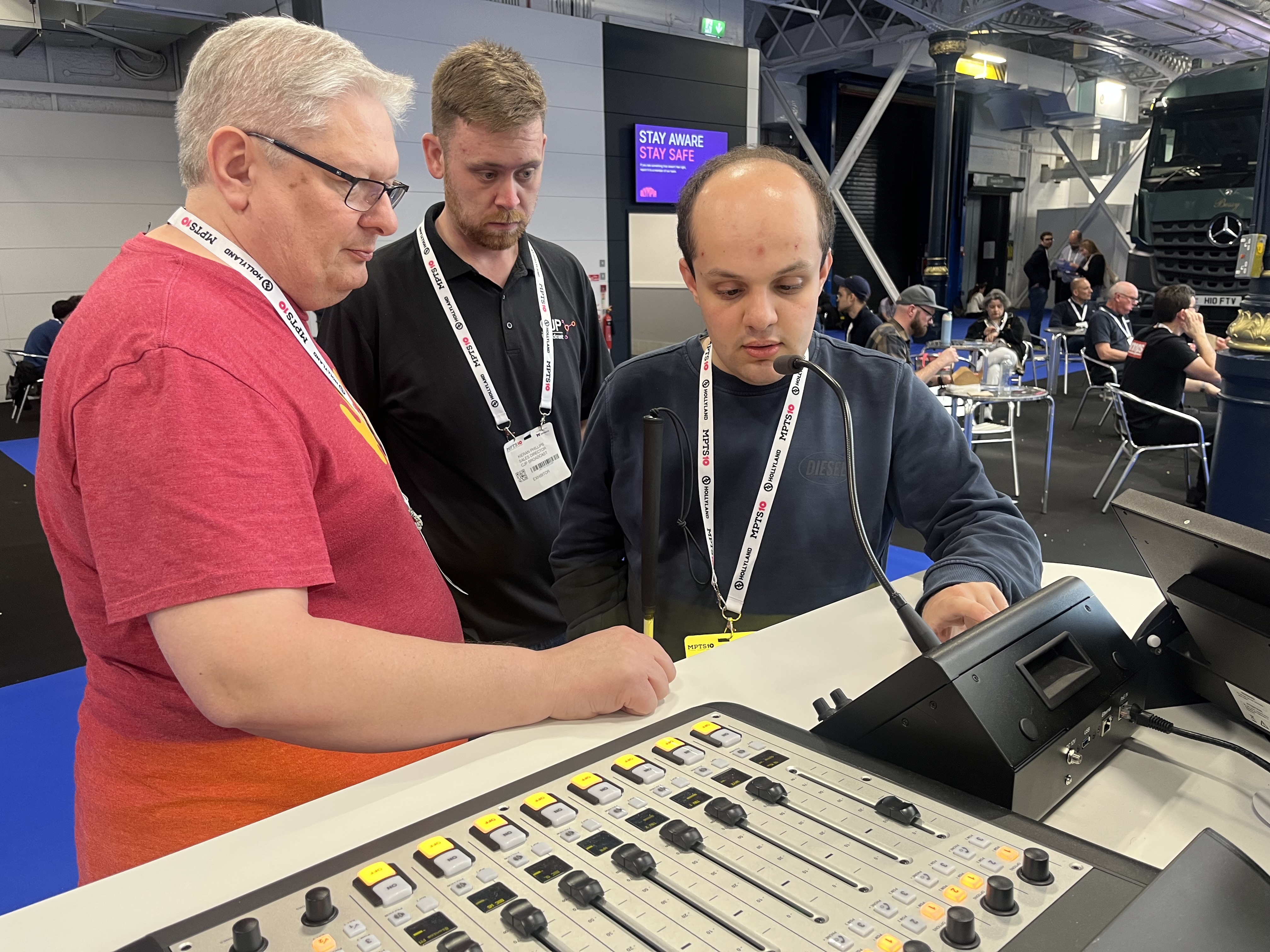 Davide trying out the voice activated equipment with a representative from Broadcast Bionics and Kieran from CJP